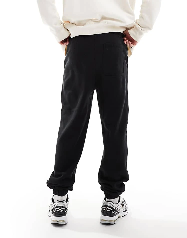 Cotton:On Baggy Cuffed Track Pant In Black For Men 4 Cotton:On Baggy Cuffed Track Pant In Black For Men - Image 2